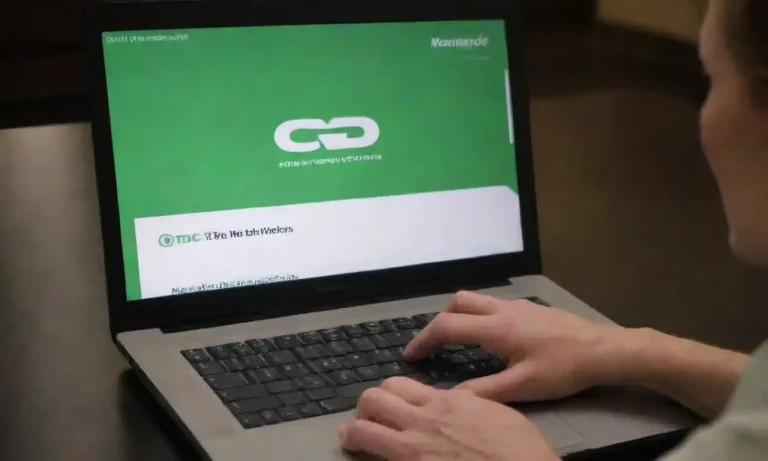 A person examining a chart of current CD rates on a laptop with the Huntington Bank logo.