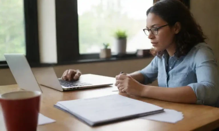 A person working at a desk with a laptop